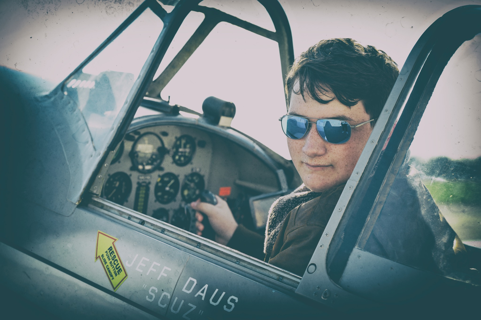 Creative senior portrait in cockpit